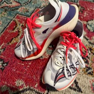 Saucony White Running Shoes with Pink Laces and Purple Heel Accents